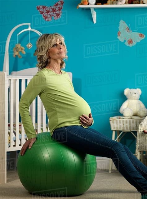 Pregnant Older Woman Exercising Stock Photo Dissolve