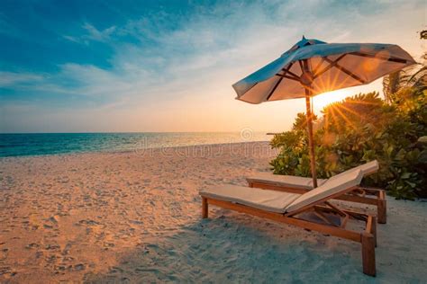 Beautiful Sunset Beach Chairs On The Sandy Beach Near The Sea Summer