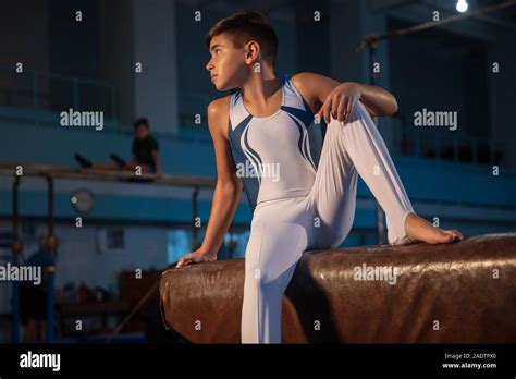 Little Male Gymnast Training In Gym Flexible And Active Caucasian Fit