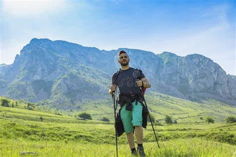 Man Hiking In Green Mountains Stock Photo Image Of Morning Grass