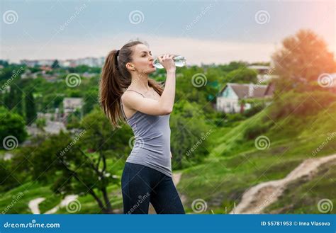 Thirsty Fitness Girl Holding Bottle Of Water Stock Image Image Of