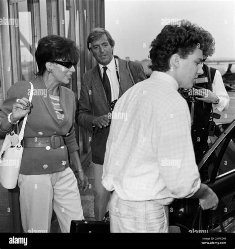 joan collins with her son sacha 17 arriving at heathrow from los angeles 8th september 1983