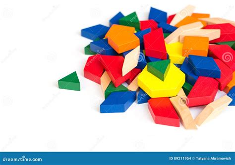 Multi Colored Pattern Blocks On A White Wooden Backgroundisolate