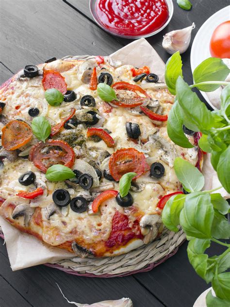 Pizza With Tomatoes Mushrooms Olives And Peppers Stock