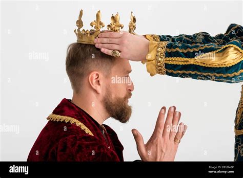 Cropped View Of Man Putting Crown On King With Praying Hands On Grey