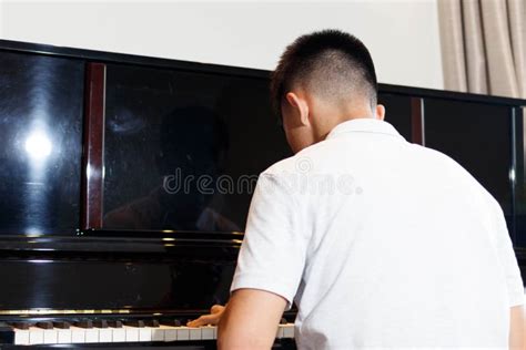 Teen Boy Playing the Piano at Home Stock Photo - Image of piano