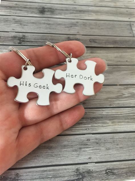 These Puzzle Piece Keychains Are Hand Stamped With His Geek On One And