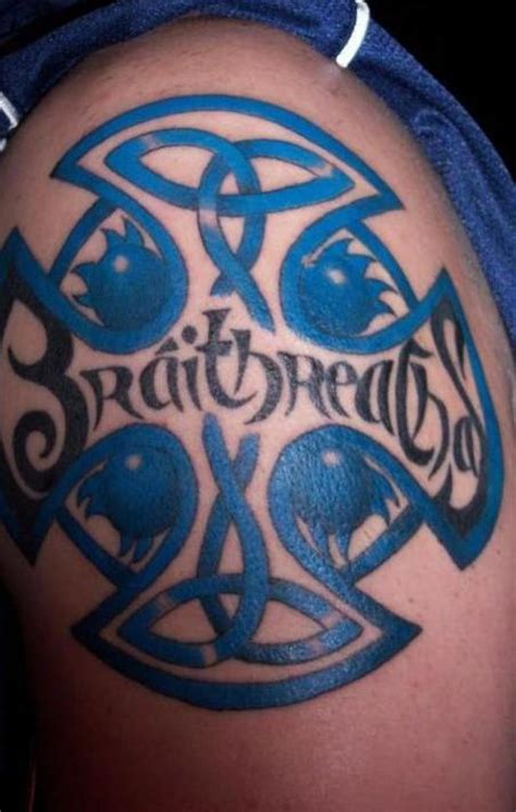 It is a traditional christian design which is design in a celtic tattoo with a loop around its branches. Celtic Lettering Tattoo