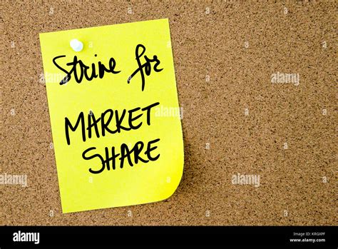Strive For Market Share Text Written On Yellow Paper Note Stock Photo