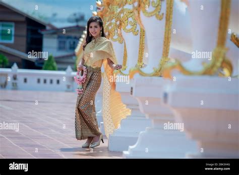 beautiful thai girl in traditional dress costume in phra that choeng chum thailand temple stock