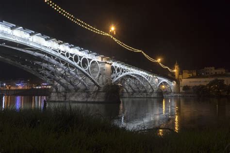 Beautiful Triana Bridge Next To The Guadalquivir River On Its Way