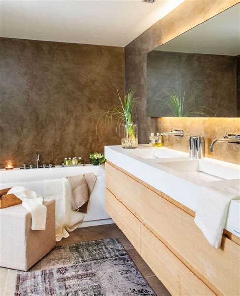 A Large Bathroom With Two Sinks And A Bathtub Next To A Rug On The Floor