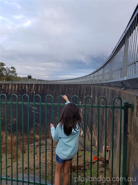 Two people sitting on opposite sides can hear each other clearly by whispering along the curved surface of the wall. Whispering Wall - Barossa Reservoir | Williamstown ...