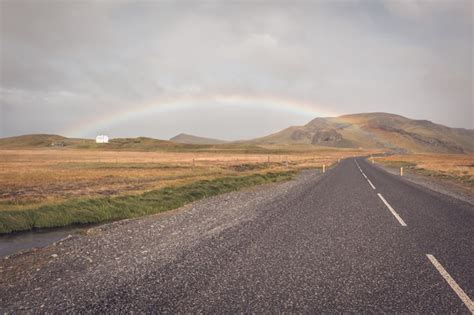Premium Photo Rainbow And Endless Icelandic Highway