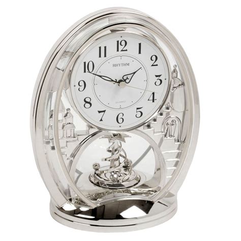 Rhythm Contemporary Modern Mantel Clock Silver Colour Rotating Twist