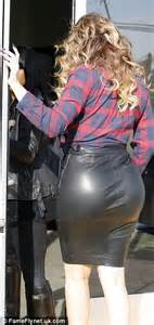 Khloe Kardashian Showcases Slim Legs In Golden Dressing