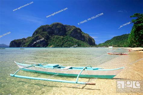 Philippines Palawan Bascuit Bay El Nido Outrigger On Tropical Beach