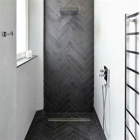 black herringbone tile bathroom