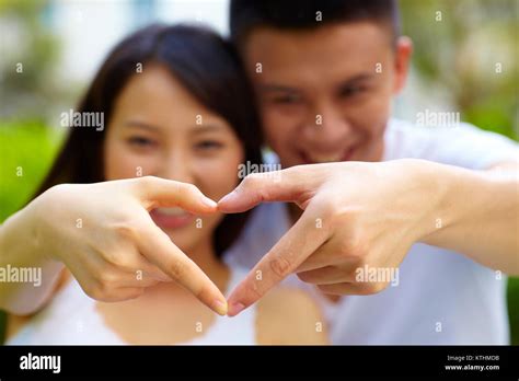 Happy Young Asian Couple Outdoor In The Park Stock Photo Alamy
