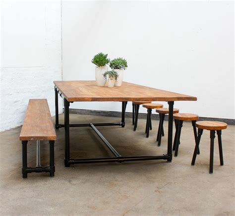 The rectangular tabletop is perfectly sized for apartment living, or for a compact breakfast nook. Noralyn Large Dining Table With Bench And Six Stools By ...