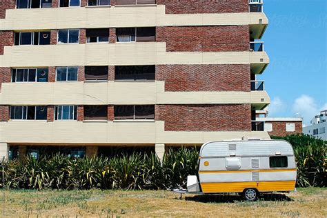 Camper Trailer In Empty Parking Lot By Stocksy Contributor Raymond