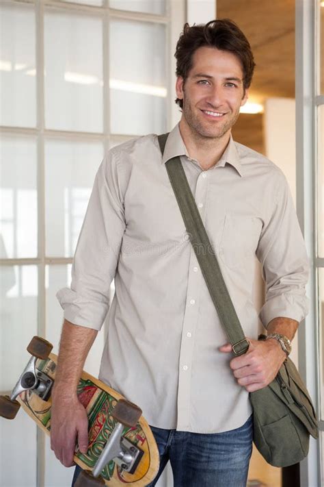 Casual Businessman Standing With His Skateboard Smiling At Camera Stock Photo Image Of View