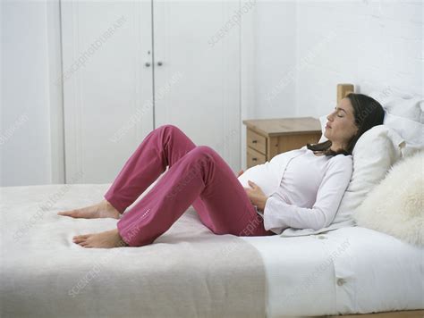 Pregnant Woman Lying On Bed Stock Image C0521232 Science Photo Library