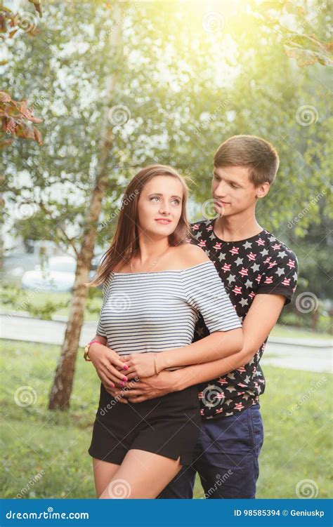 Boyfriend Hugging His Girlfriend From Behind Stock Photo Image Of
