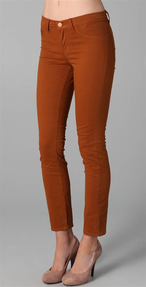 J Brand 811 Mid Rise Luxe Twill Skinny Jeans In Red Terra Cotta Lyst
