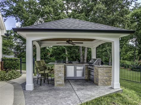 Get outdoor kitchen ideas from thousands of outdoor kitchen pictures. This impressive outdoor cooking area features a hip roof with arches over a decorative ...