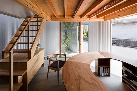 About living room of satoshi. satoshi saito encloses 'house in sakai' behind tall ...