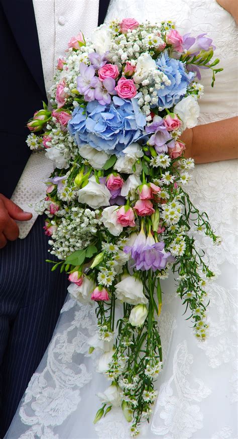 A Cascading Wedding Bouquet In Pastel Colours At Blake Hall