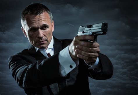 Secret Agent Armed With Handgun Stock Photo - Download Image Now - iStock