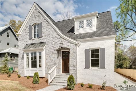 White brick makes this house feel like home. Stone and Painted Brick Tudor | Blake Shaw Homes | Atlanta ...