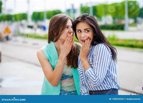 Two Young Women Talking To Each Other Stock Photo Image Of