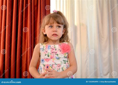 The Little Scared Girl Cries In The Kindergarten Hall Stock Image