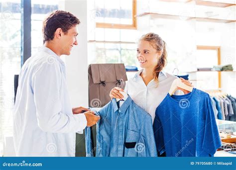 Shop Assistant Helping To Choose Clothes Stock Photo Image Of Casual Owner