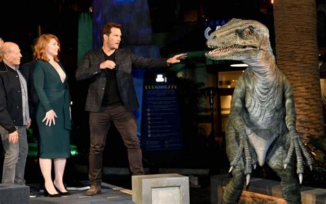 chris pratt and bryce dallas howard unveil new and improved jurassic world ride — and it s now