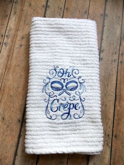 Try decorating with blue kitchen towels, curtains or a canister set to hold dry foods. Embroidered Kitchen Towel Oh Crepe Variegated Blue | Etsy ...