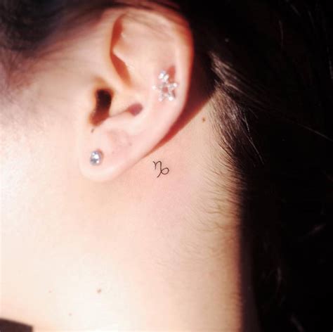 Capricorn Zodiac Symbol Tattoo Behind The Left Ear