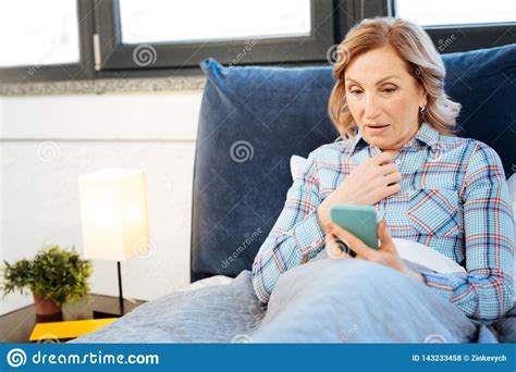 Smiling Short Haired Mature Lady Being Contented With Information Stock