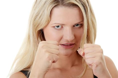 Premium Photo Portrait Of Angry Woman Showing Fists Against White