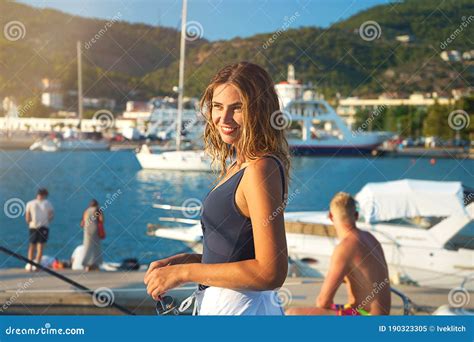 Young Happy Woman In Sunglasses Feels Fun On The Luxury Sail Boat Yacht