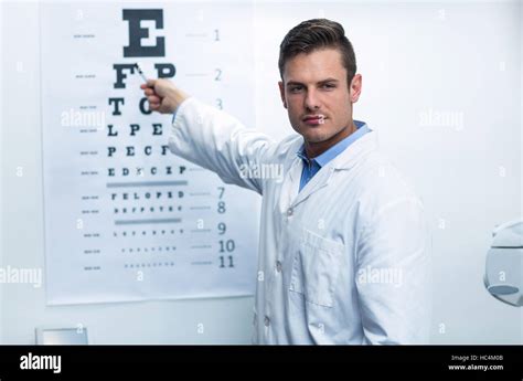 Optometrist Pointing At Eye Chart Stock Photo Alamy