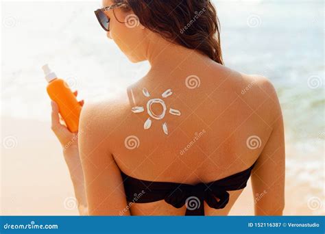 Skin Care Sun Protection Beautiful Woman In Bikini Apply Sun Cream On Face Woman With Suntan