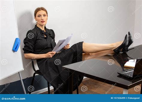 Teacher Sits At Her Desk In The Classroom Stock Image Image Of