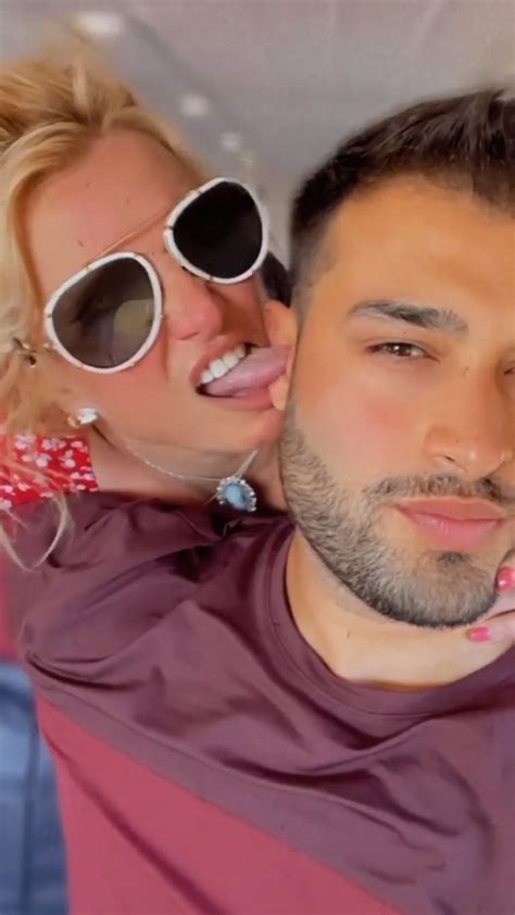 britney spears licks the inside of sam asghari s ear and straddles her fiancé in a hot tub on
