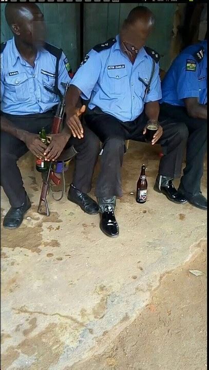 Nigerian Police Officers Spotted Drinking While With Gunsnigerians