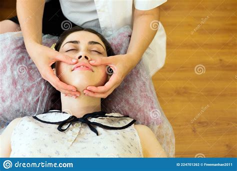 The Concept Of Medicine And Cosmetology Young Caucasian Woman In A Facial Massage Session