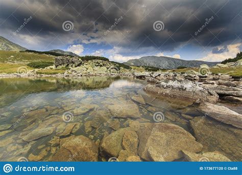 Dramatic Scenery In The Alps With Stormy Cloudscape Stock Photo